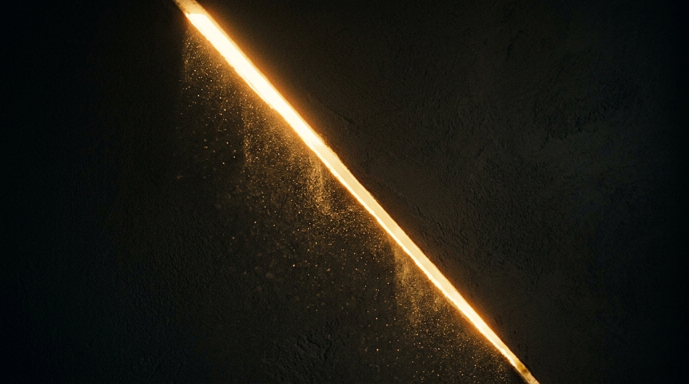A shaft of light opening across a dark room